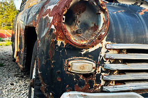 Rusty Vintage Car with Weathered Exterior in Natural Outdoor Setting, a Photo by AS photostudio