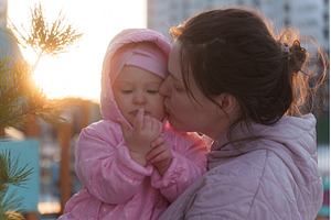 Mother kisses daughter in cozy, a Nature Photo by darksoul72