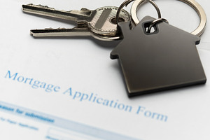 Mortgage application form with house keys for real estate loan, a Business Photo by Olena Rudo