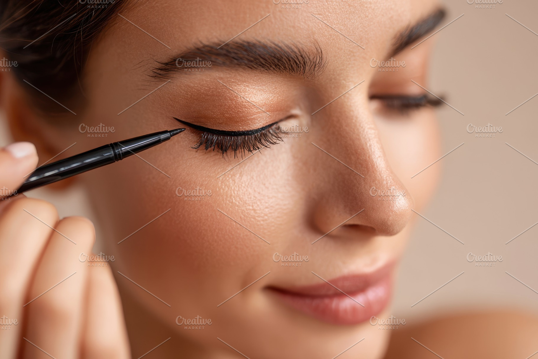 Woman applying eyebrow gel with a smile, a Beauty & Fashion Photo by AlyaAnd
