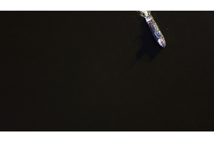 Aerial top view of a ship sailing on, a Transportation Photo by Media Whale Stock