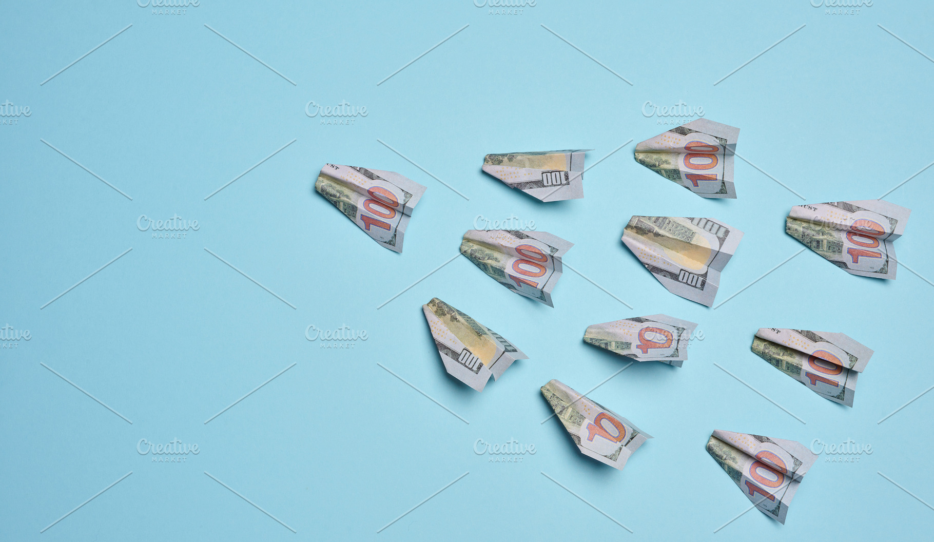 Paper airplanes made of hundred-dollar bills flying in one direc, a Business Photo by ndanko