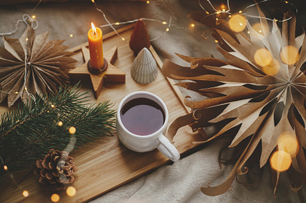 Merry Christmas. Cup of tea, christmas stars, golden lights, tre, a Holiday Photo by Sonjachni