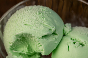 green ice cream with mint flavor and smell, natural ice cream with mint flavor,, a Photo by rsoollAI