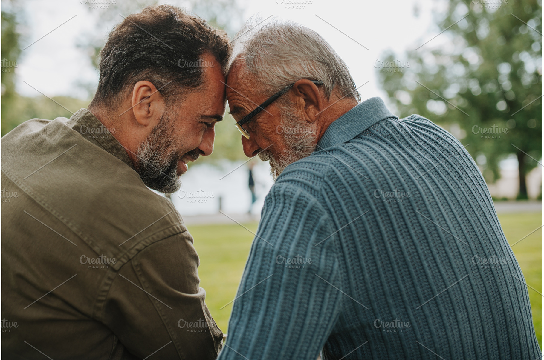 Father and adult son sharing a, a Person Photo by HalfPoint