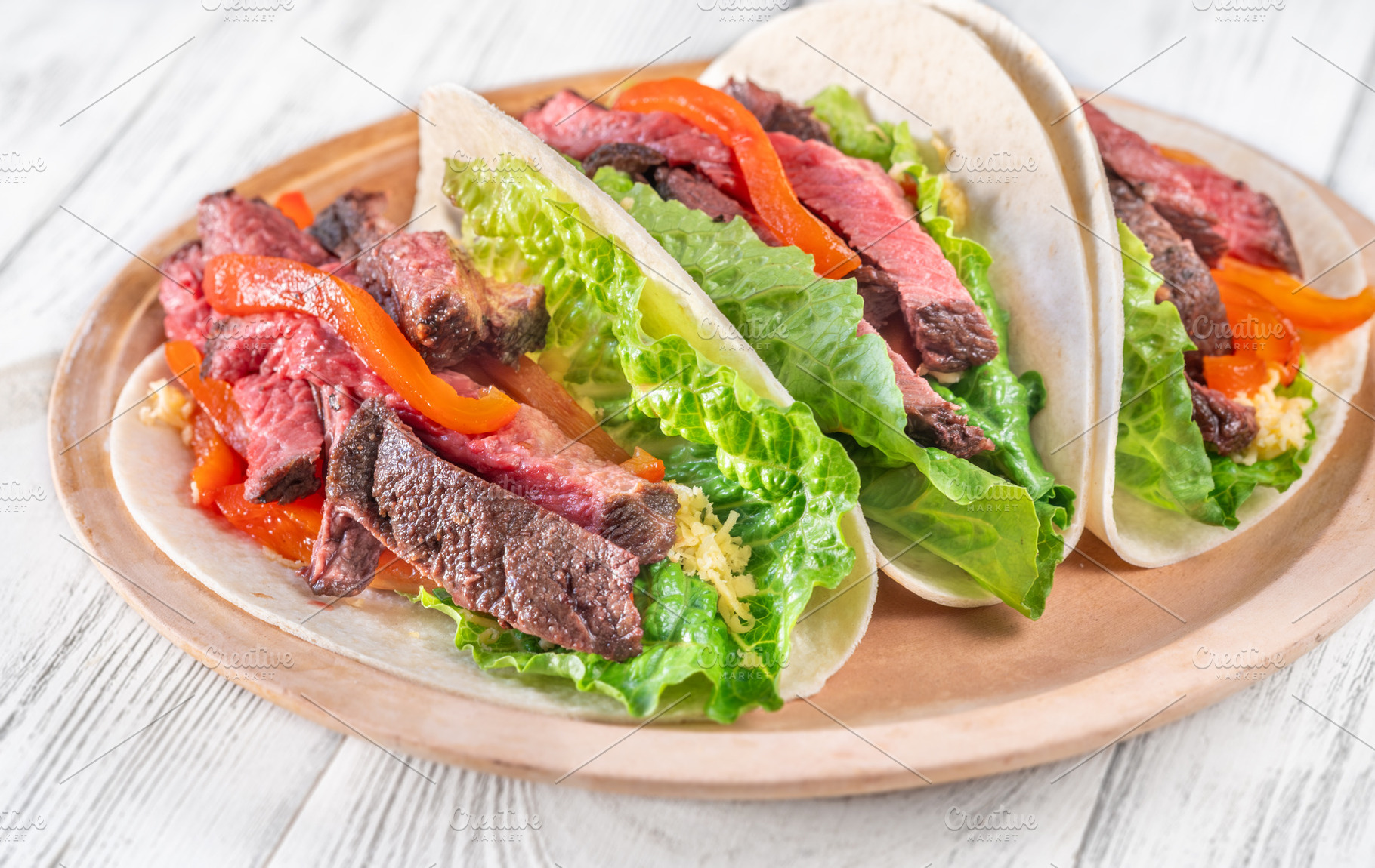 Three carne asada tacos, a Food & Drink Photo by Alexander Prokopenko