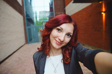 Business woman doing selfie on the street, a Person Photo by Zorgens