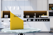 hardcover book mock up in kitchen, a Books & Magazine Mockup by Daniel Megias (Thumbnail 1 of 2)