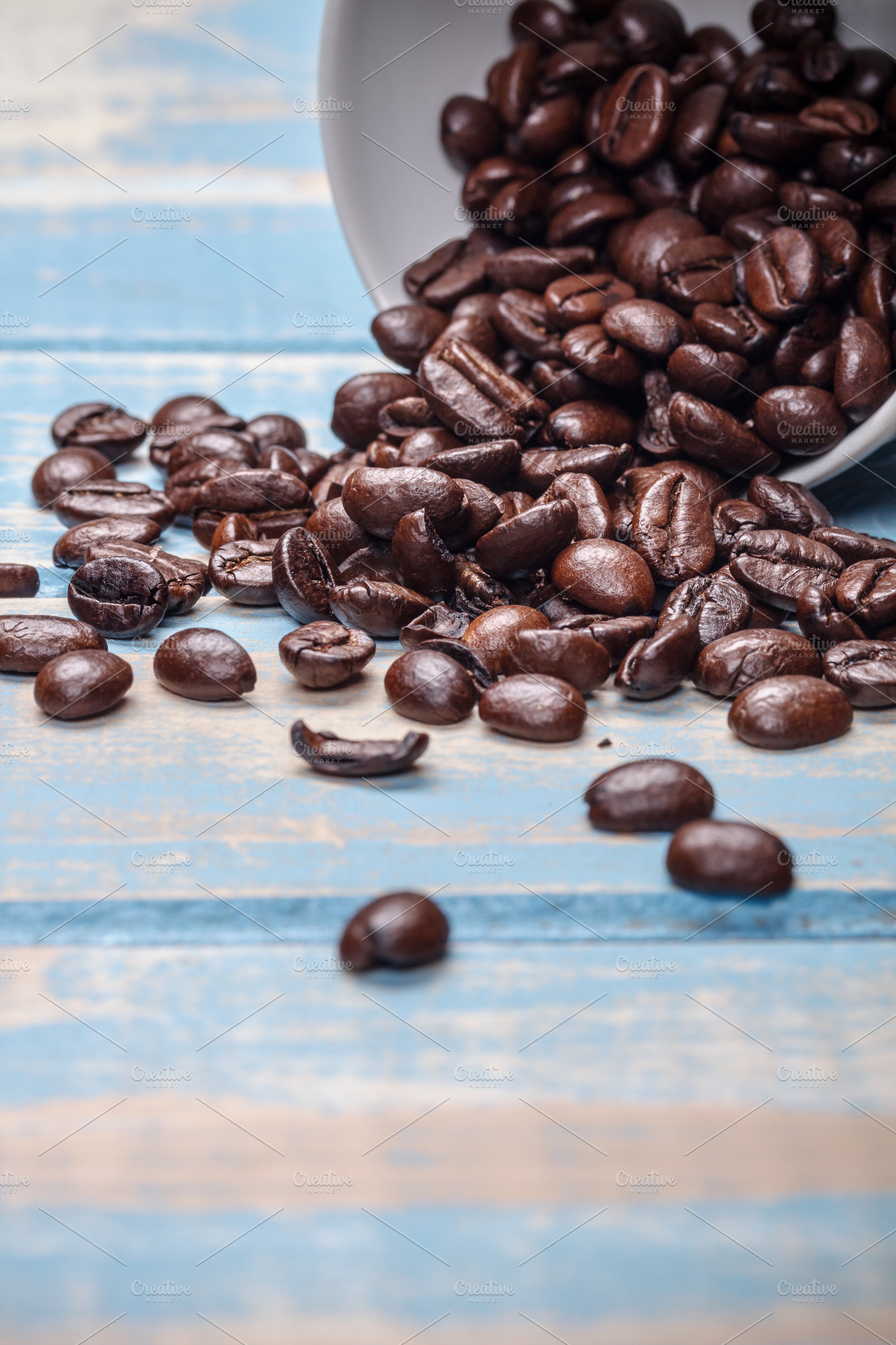 Coffee beans featuring cup, coffee, and closeup