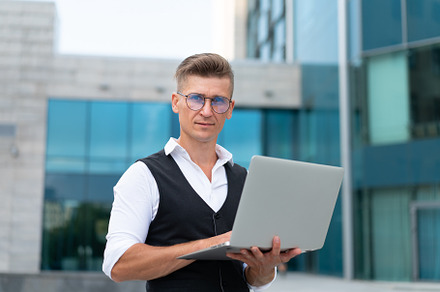 Business. Businessman Using Laptop Outdoors. Modern Technology Concept, a Person Photo by andreonegin market