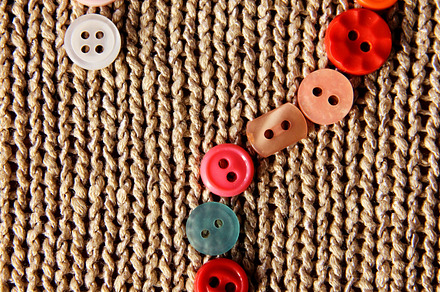 Buttons on knitted background preview 6