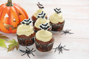 Halloween cupcakes decorating with bats, pumpkin, and spiders, a Food & Drink Photo by Olena Rudo