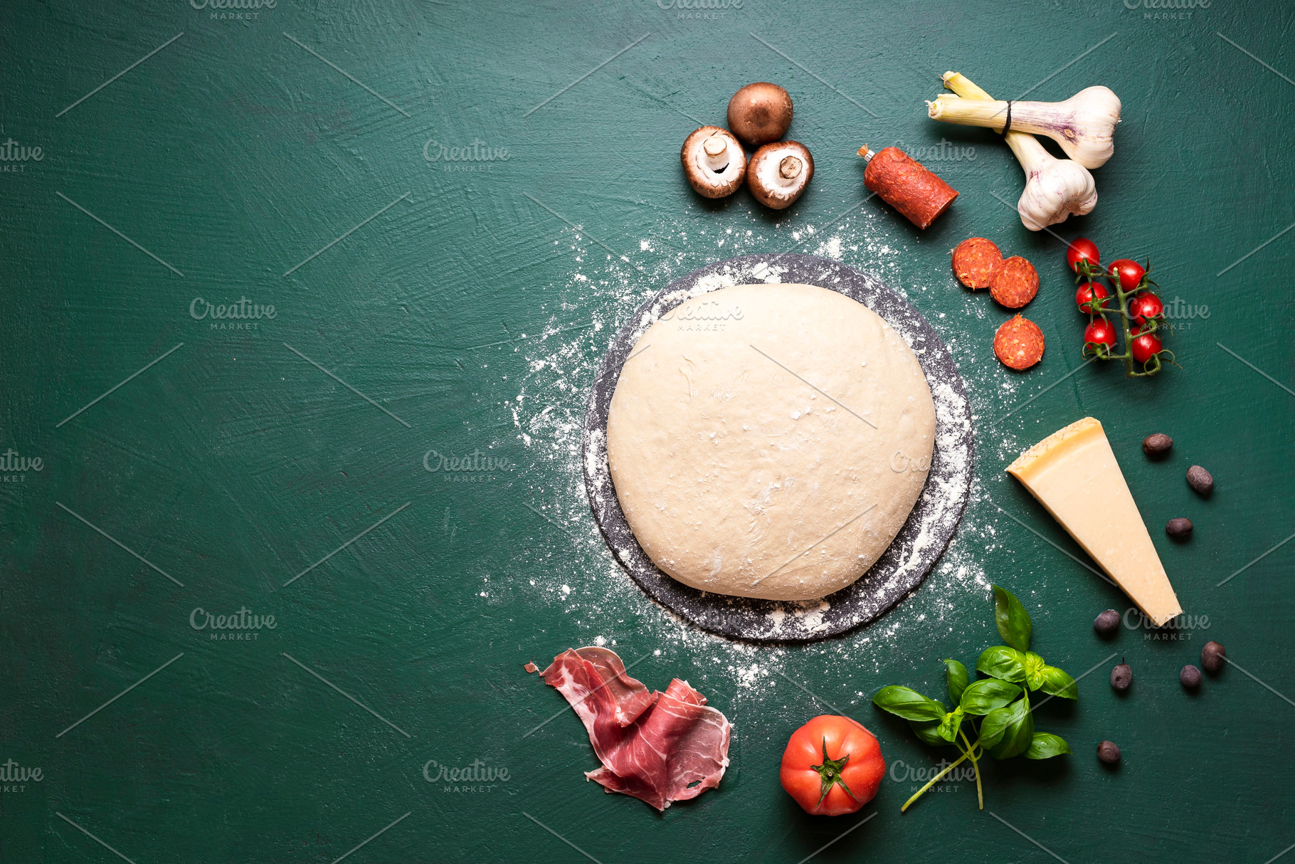 Pizza ingredients and raw dough on t, a Background Photo by YesPhotographers