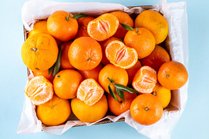 Fresh tangerines, mandarin clementines, raw farm organic citrus, a Photo by Rimma