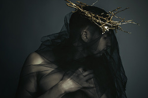 Man in black cloth and a gold crown featuring imposing, caucasian, and fashion