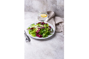 Bowl of fresh green salad mix, a Food & Drink Photo by Yulia Furman