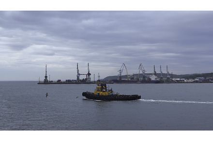Fishing boat on background of port, a Nature Photo by Media Whale Stock