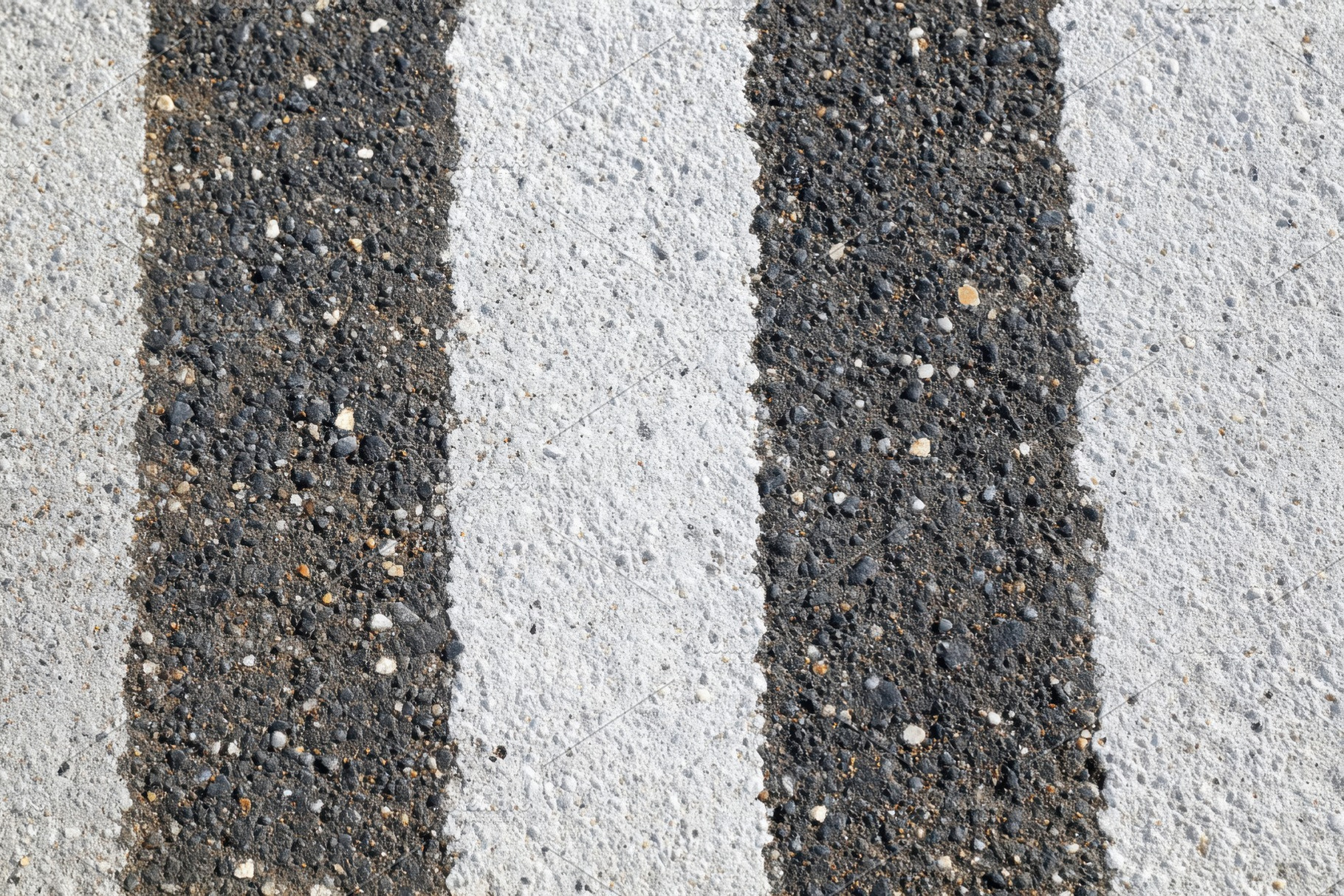 Textured Road Surface with Stripes, a Background Photo by AlyaAnd