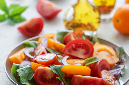 Green salad from leaves and tomatoes, a Food & Drink Photo by Olena Rudo