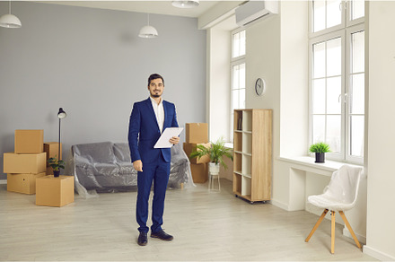 Real estate agent standing in modern, a Person Photo by StudioRomantic
