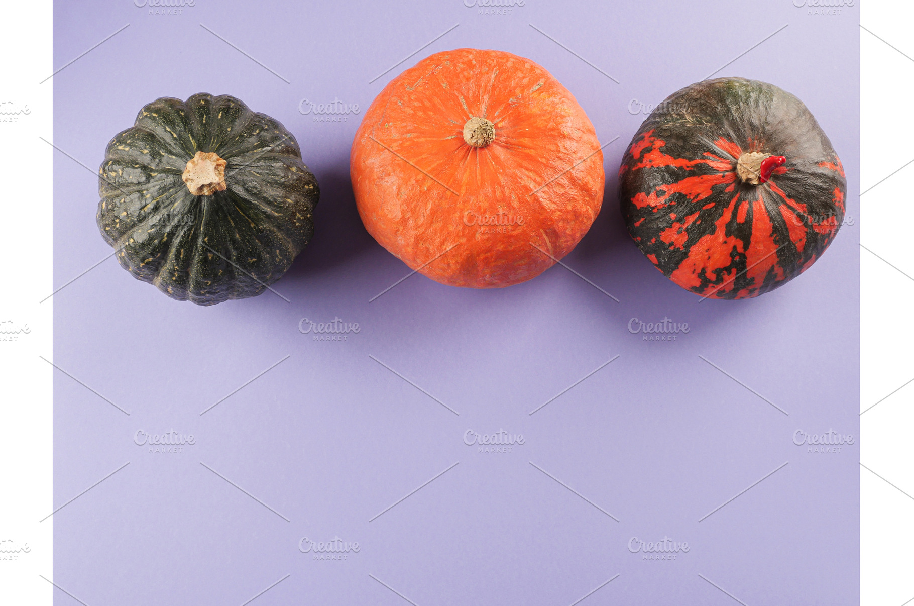 Three colorful pumpkins on purple, a Food & Drink Photo by Lifemorning