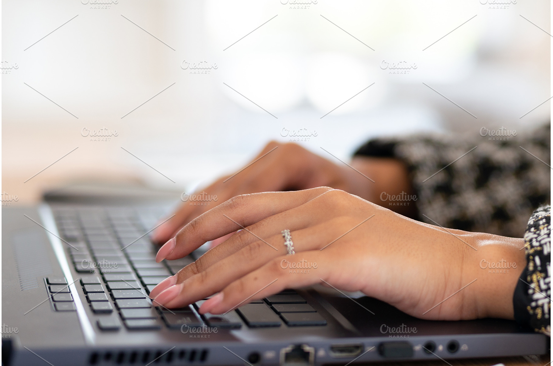 Close-up of a womans hands typing on, a School & Education Photo by undrey