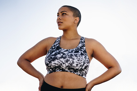 Curvy woman in sportswear with hands on hips, a Person Photo by Jacob Lund