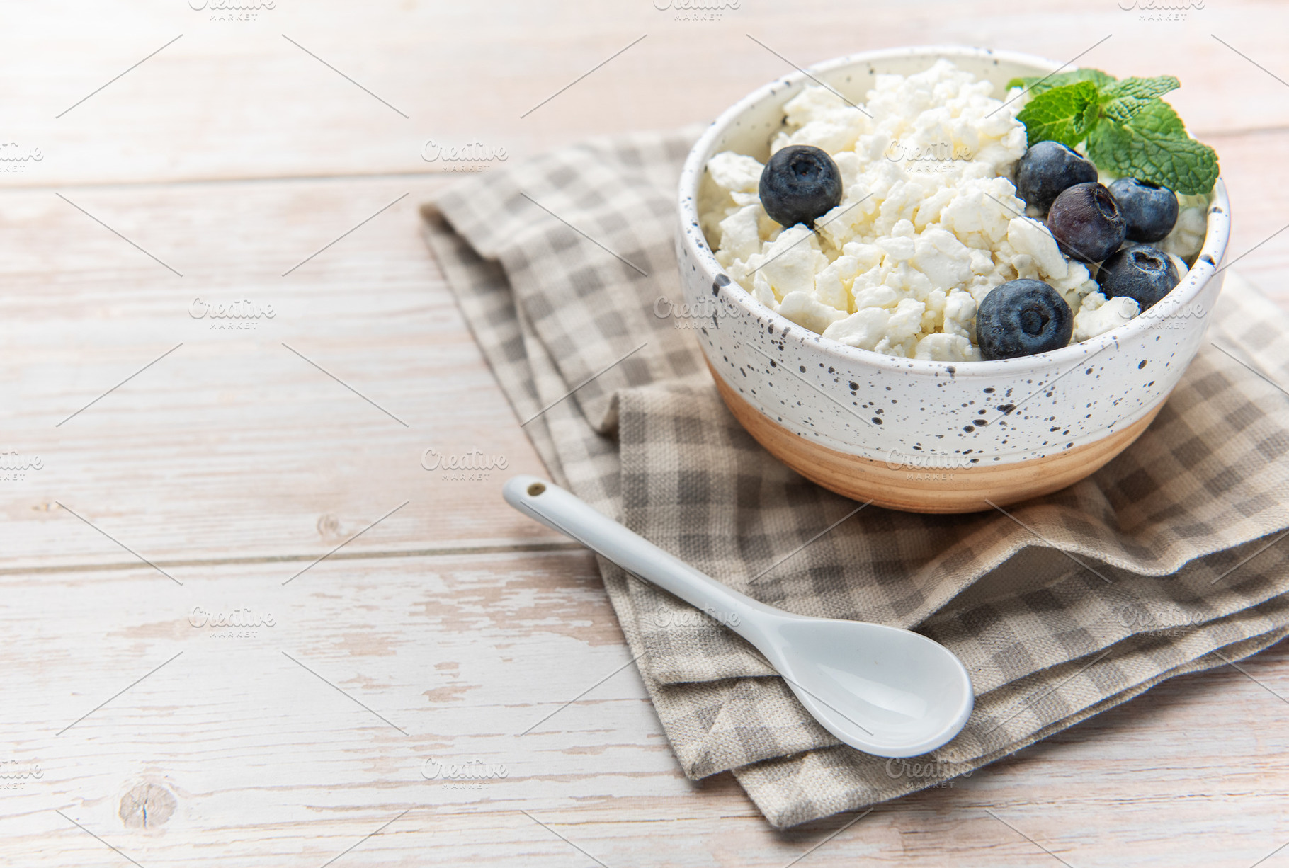 Cottage cheese with blueberries and mint for a healthy breakfast, a Food & Drink Photo by Olena Rudo