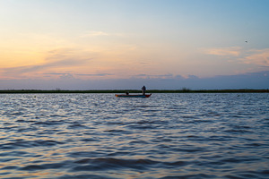 Boat at sunset on Lake Tempe, Sulawesi, Indonesia, a Nature Photo by GoodGoods