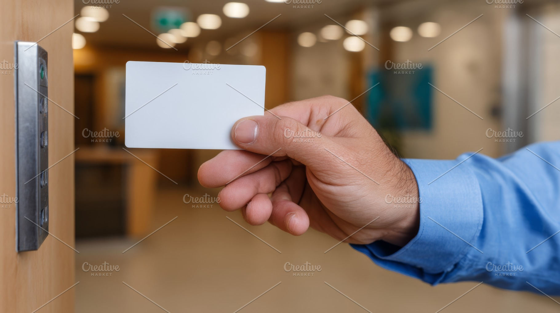 A hand of a male adult is holding a blank access card near an elevator button i, a Business Photo by ImageMir