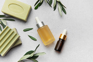 Natural soap, essential oil and olive branches creating relaxing, a Health & Medical Photo by Olena Rudo