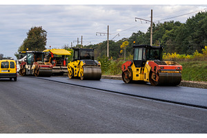 Heavy Asphalt Road Roller with Heavy, an Industrial Photo by volodymyrshtun13795