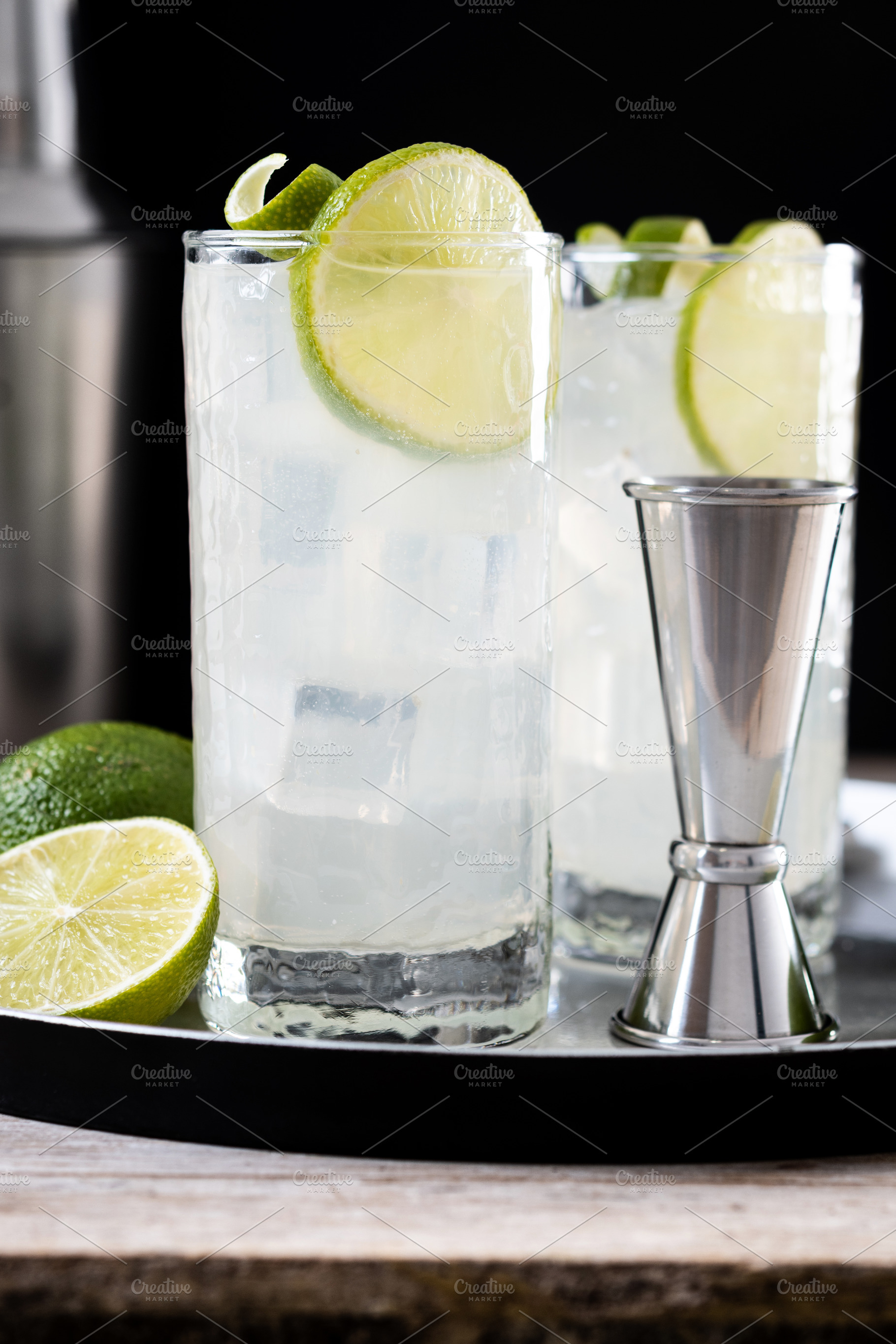 Gin Fizz cocktail with lime on black background, a Food & Drink Photo by etorres69