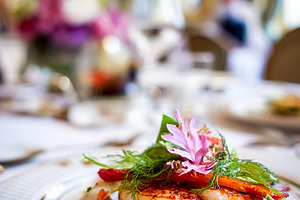 Pan seared scallops plated with fresh herbs and edible flowers,, a Food & Drink Photo by Studio ANNA