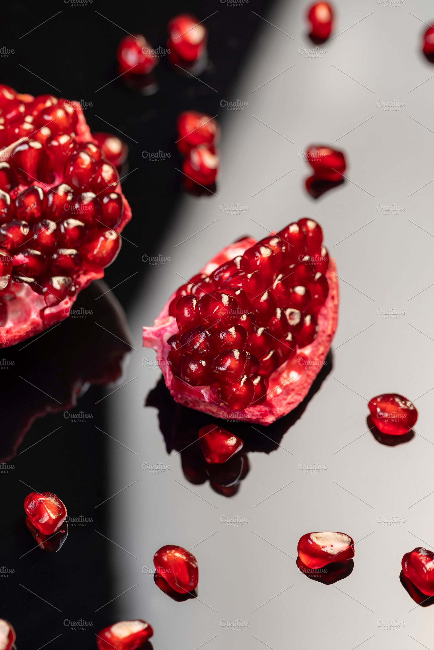 large ripe pomegranate seeds on the table, a Photo by rsoollAI