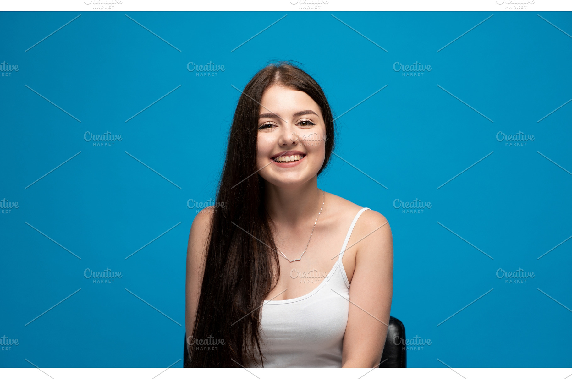 Smiling young woman showing, a Person Photo by volodymyrshtun13795