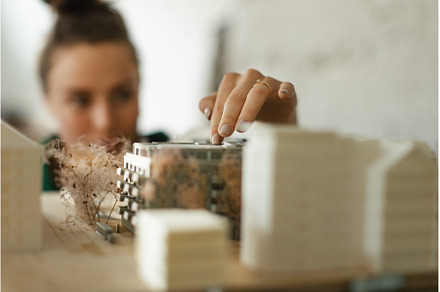 Young female architect hard working, a Business Photo by HalfPoint