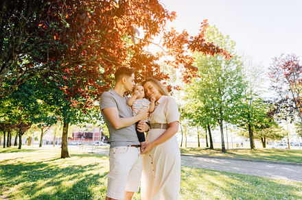 Portrait of a young family with their nine month old baby