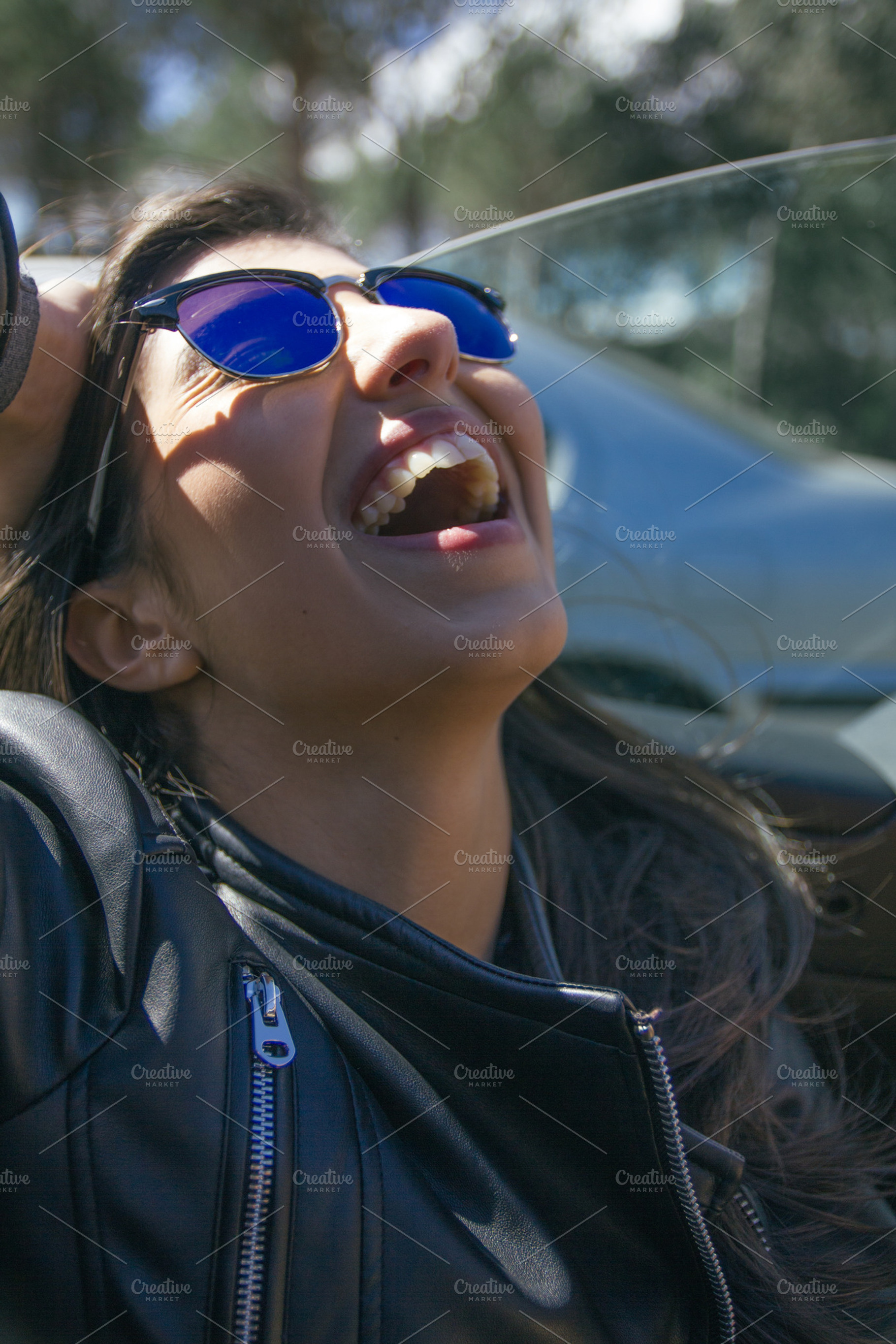 Woman with sunglasses laughing containing attractive, auto, and beautiful, a Person Photo by Am.Benitez Estudio