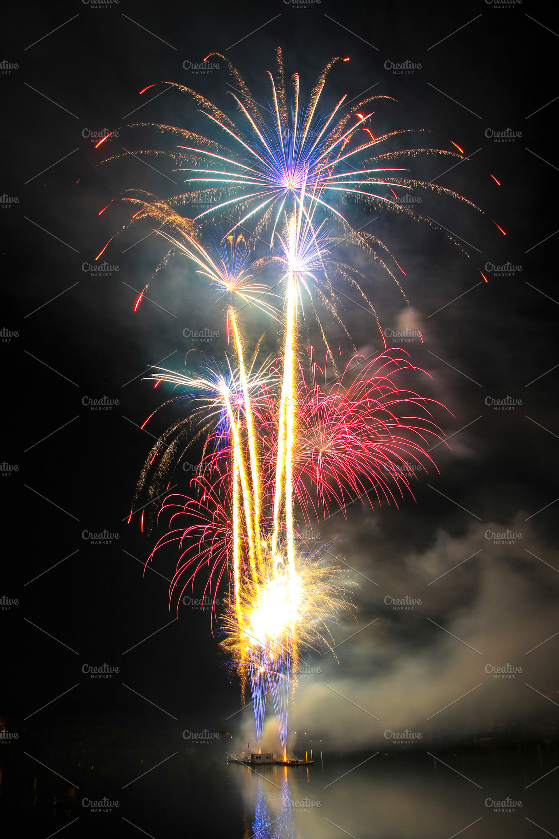 Fireworks over night the water, an Abstract Photo by Tomas Luka