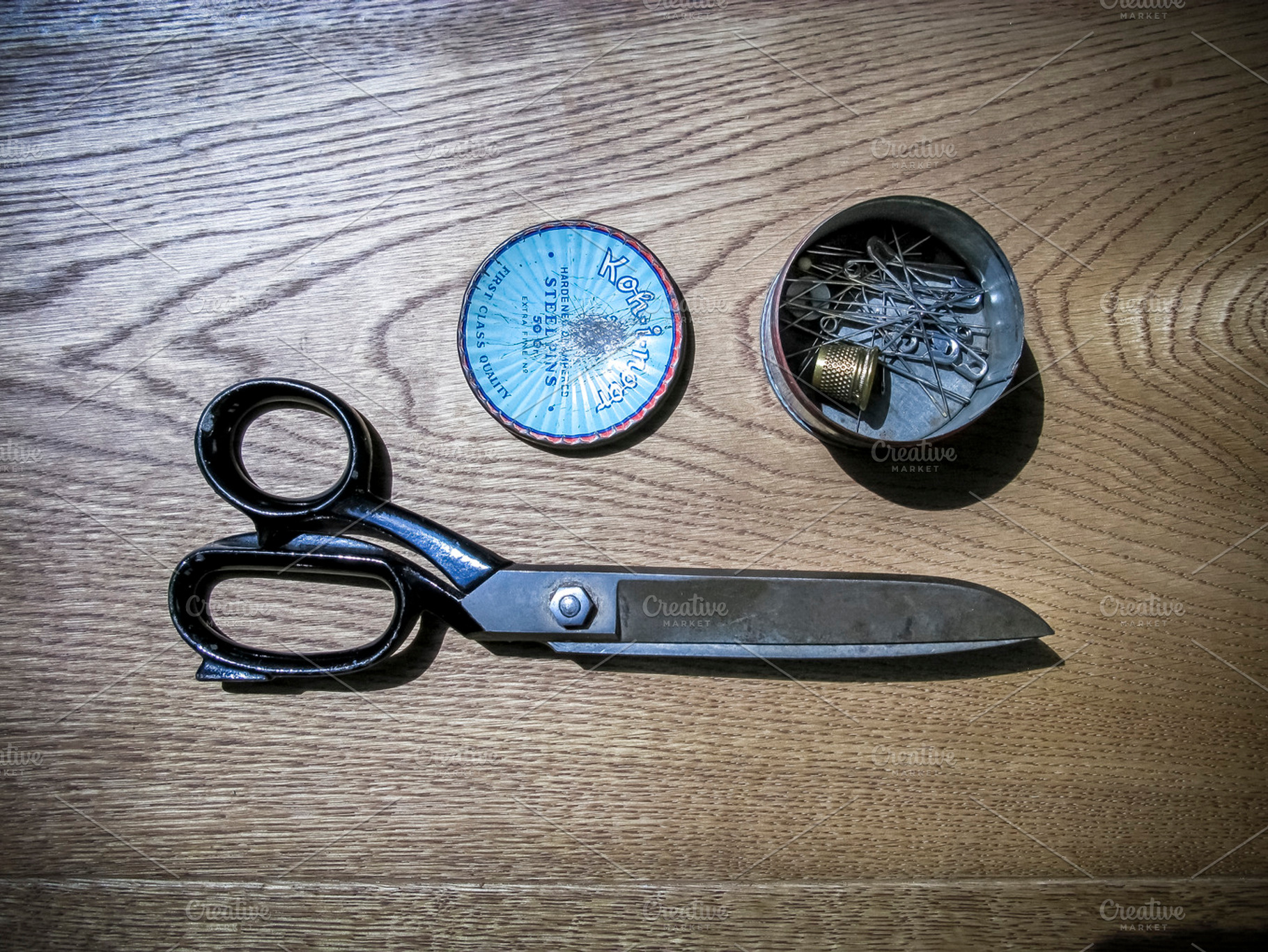 Big fabric scissors containing scissors, cloth, and fabric