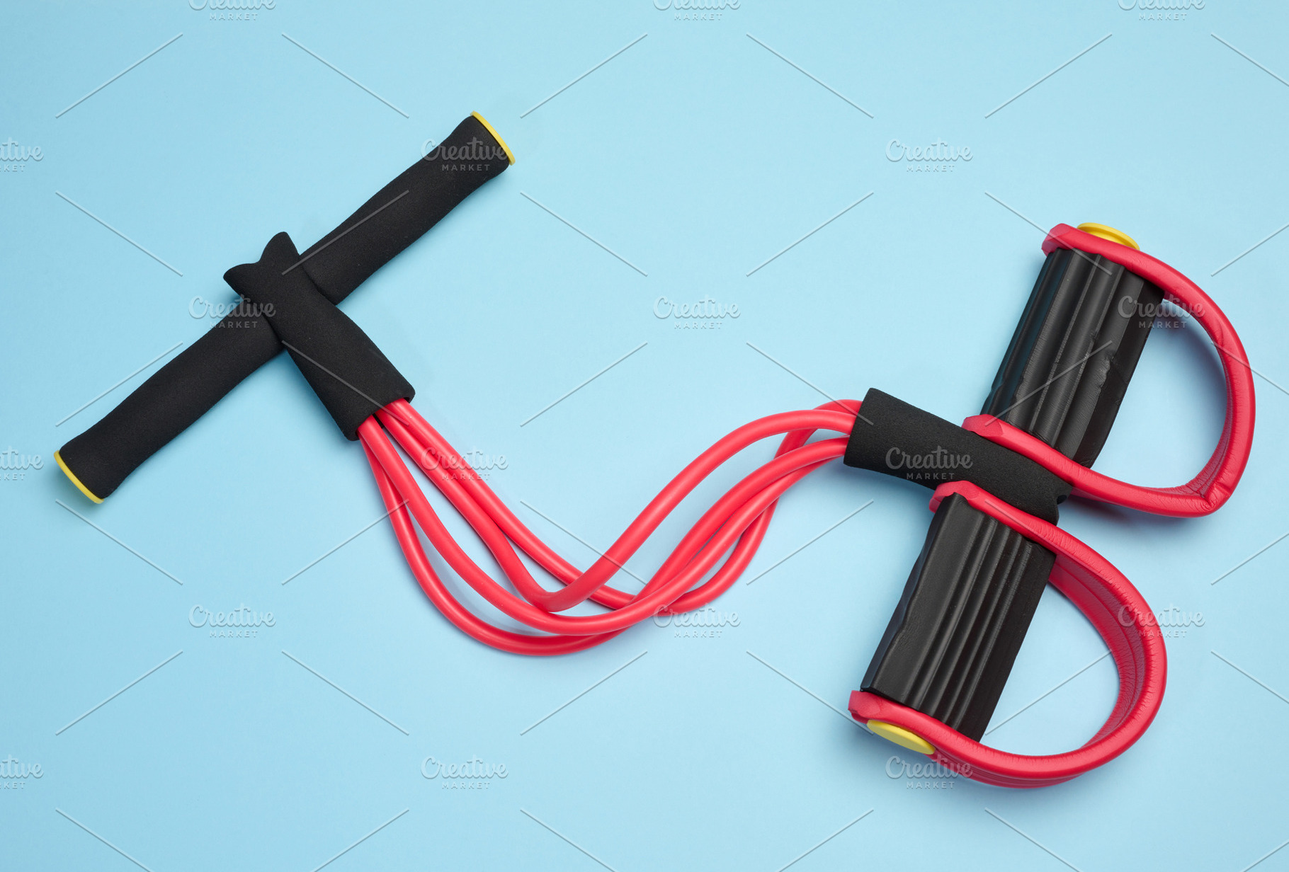 Red and black fitness expander, four elastic tubes, soft handles, a Sports & Recreation Photo by ndanko