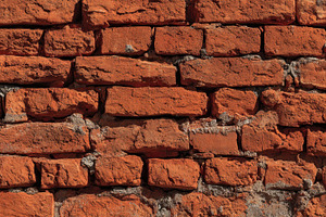 Rustic red brick wall with sunlight, a Photo by Pavel_design