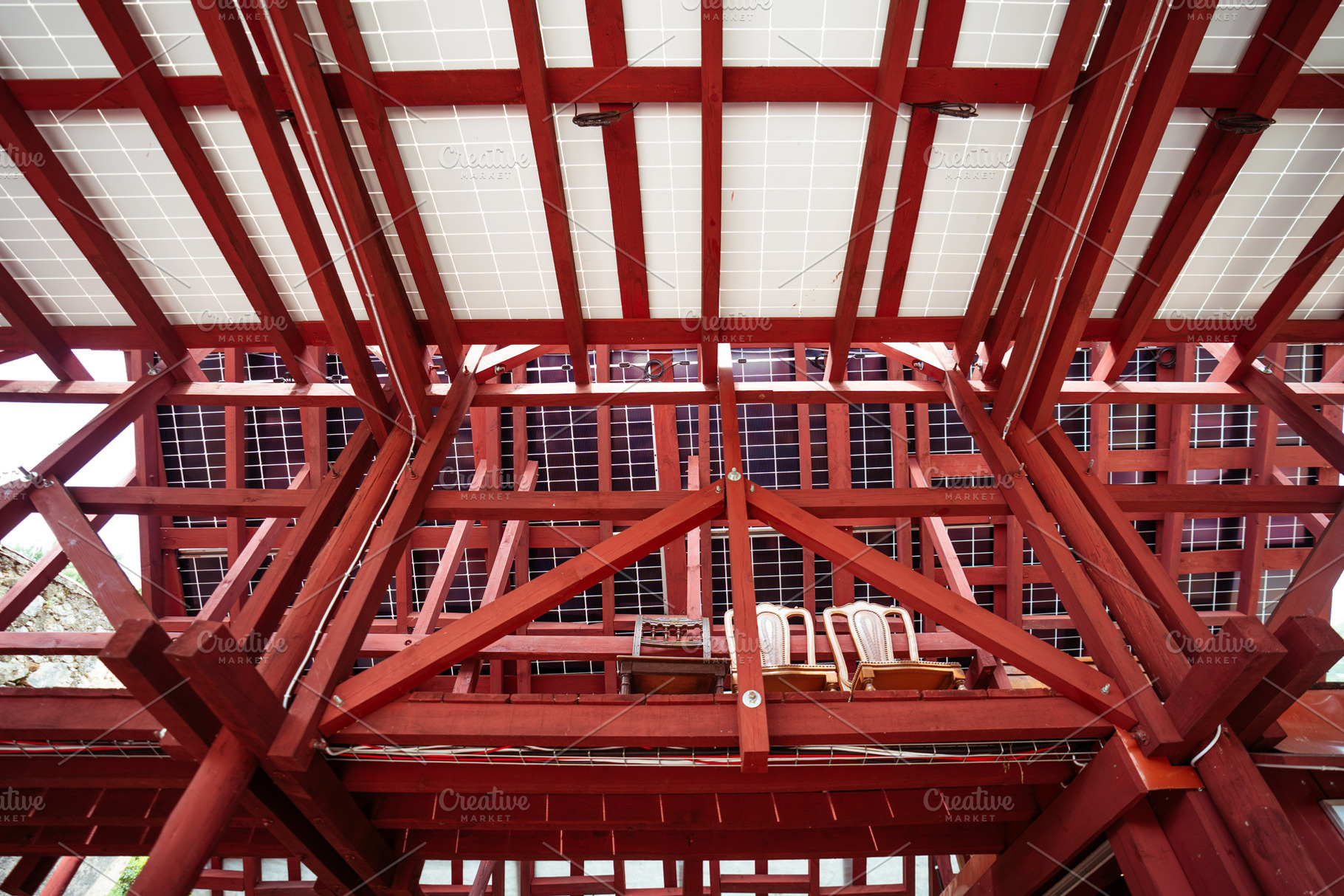 Red wooden attic with solar panel, an Architecture Photo by SkyNext