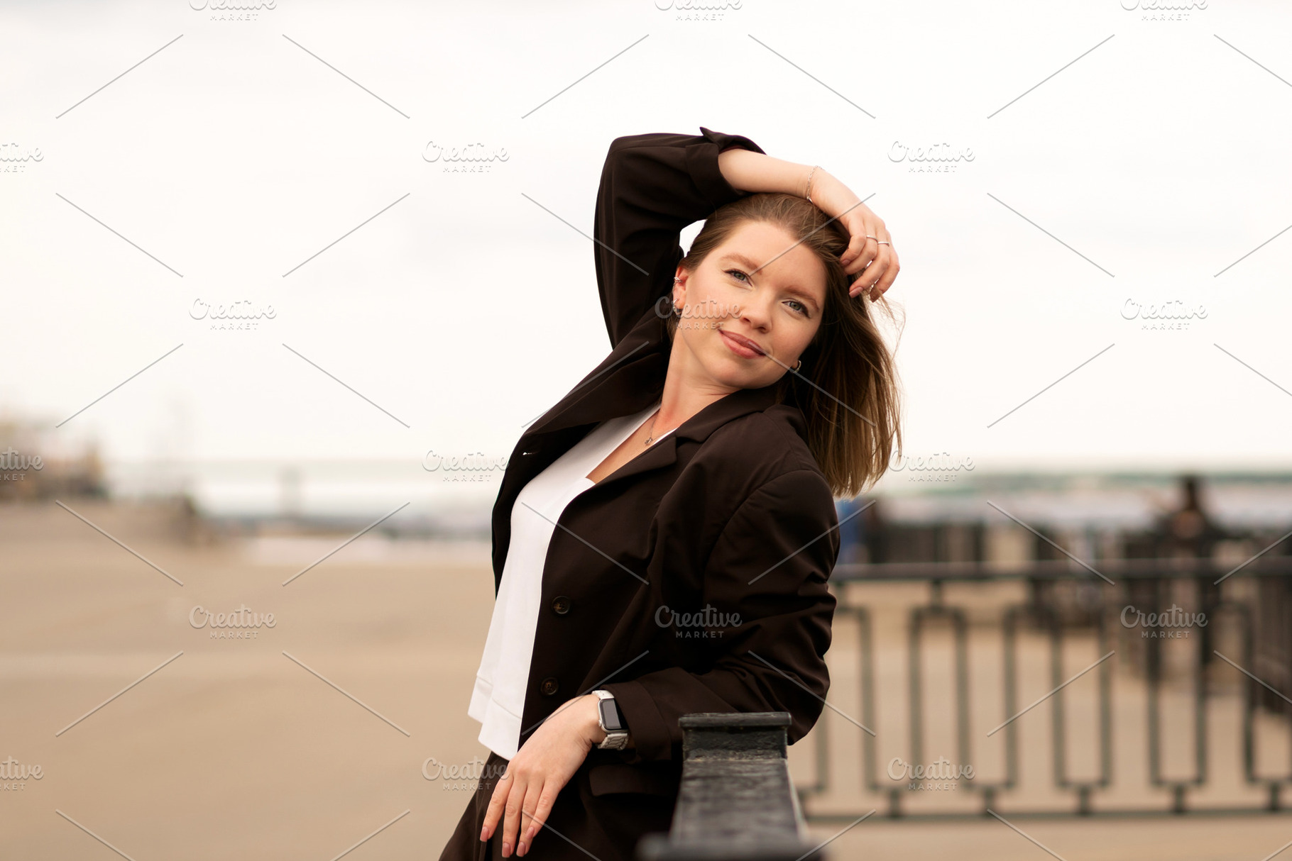 Woman in brown suit resting arm, a Person Photo by Elena Vagengeim