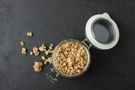 Granola in a jar on a black table