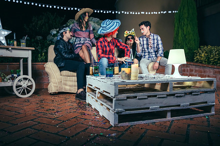 Pallets table with beverages and confetti in party, a Person Photo by davidpereiras
