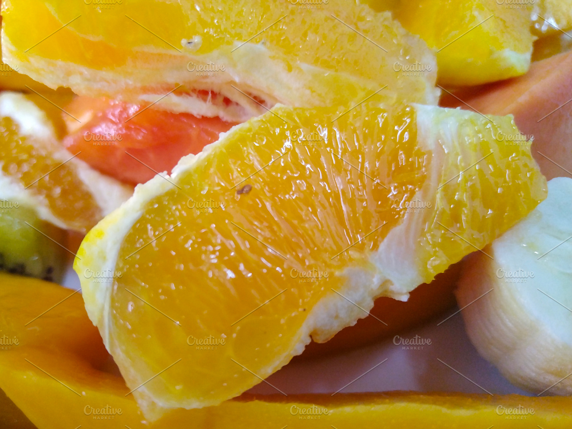 Fruit salad with citrus and melon, a Food & Drink Photo by DanFLCreativo