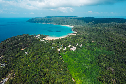 Tropical island from above and clear blue sea, a Nature Photo by Art Rachen