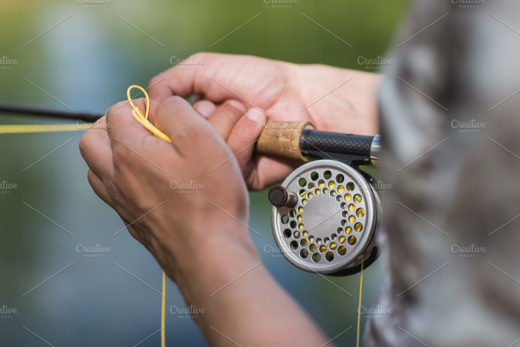 fly fisherman casting his rod on a, a Sports & Recreation Photo by IlyaMarchenko